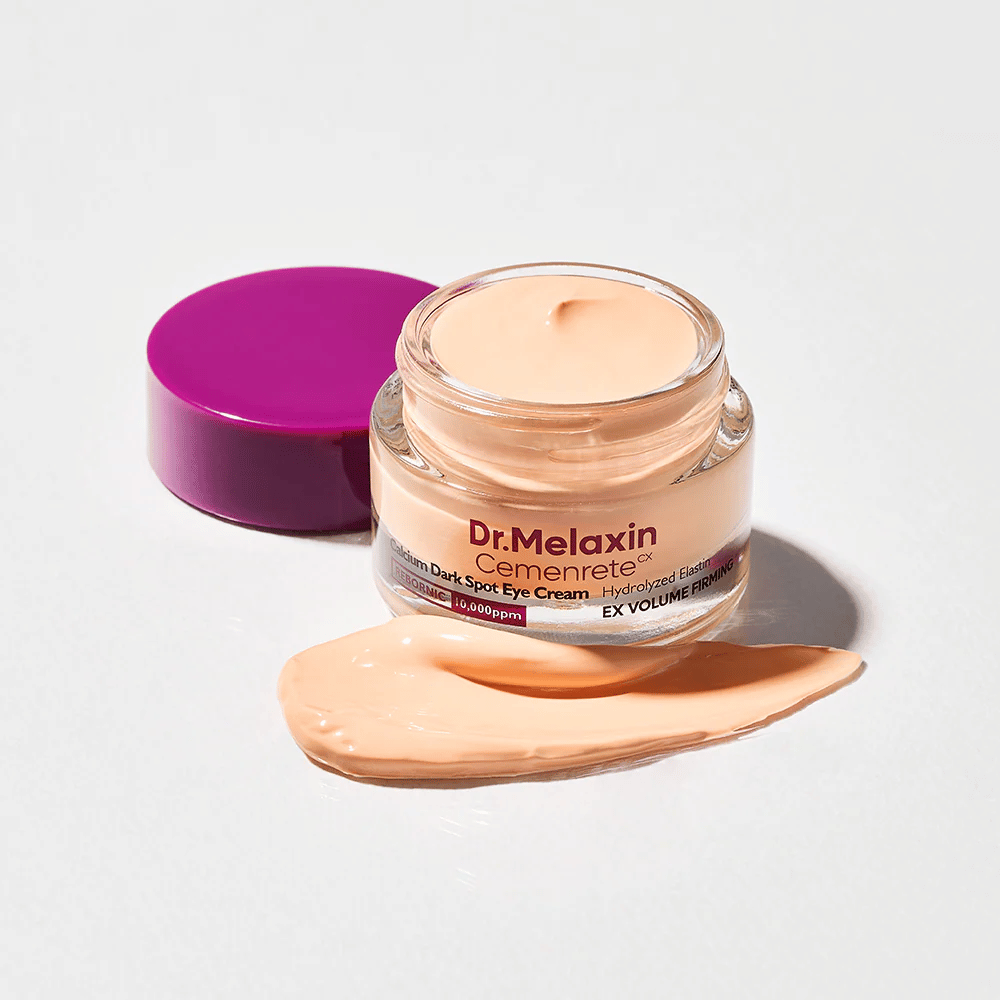 Dr.Melaxin Cemenrete Calcium Dark Spot Eye Cream avoimessa purkissa, jossa on voidekoostumus, silmänympärysvoide, joka auttaa vähentämään tummia silmänalusia ja kiinteyttämään ihoa silmien ympärillä.