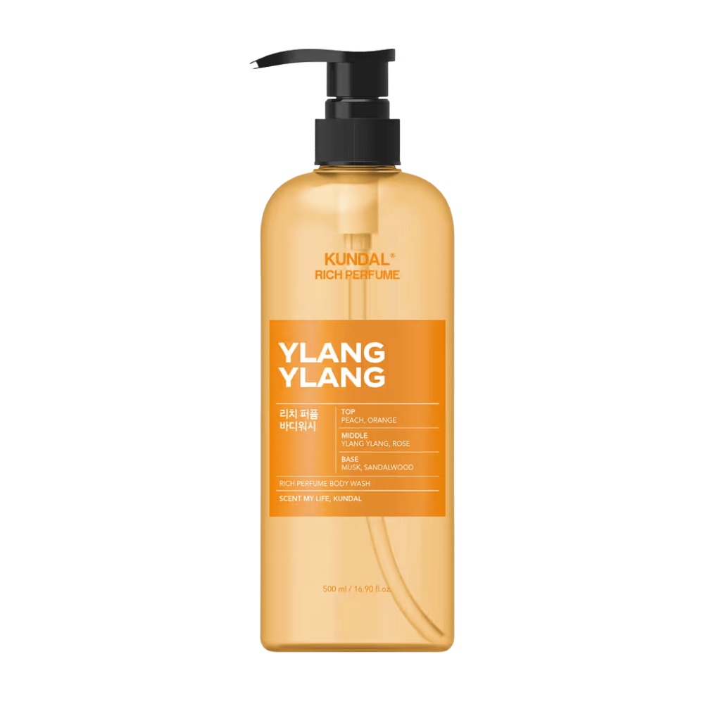 6. KUNDAL Rich Perfume Body Wash Ylang Ylang 500 ml – oranssi suihkusaippua pumppupullolla